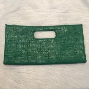 Green faux alligator clutch. Hot pink inside.
